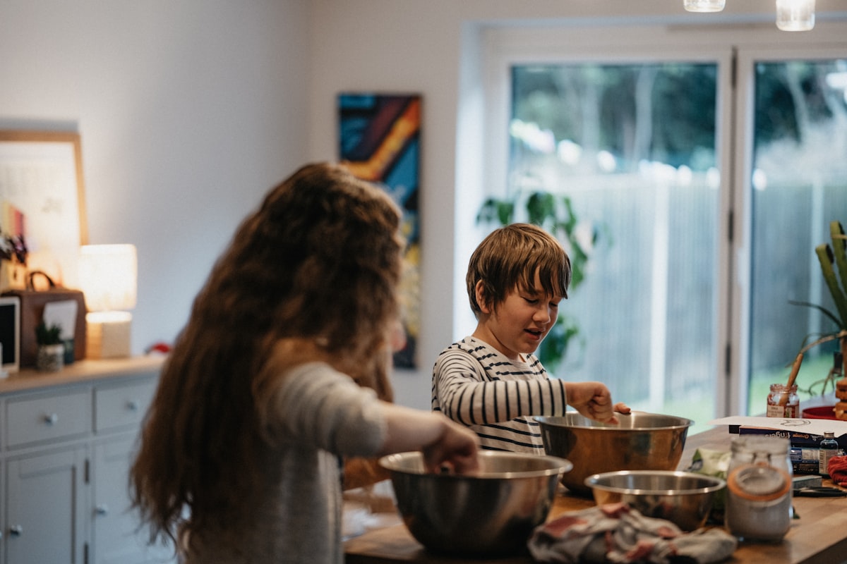 Family cooking together in kitchen